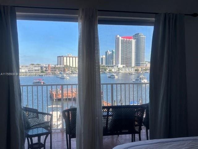 exterior space featuring a city view and a water view
