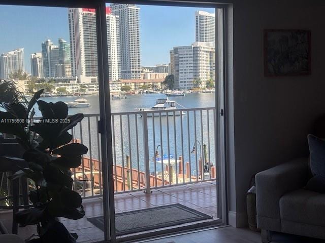 balcony featuring a city view and a water view