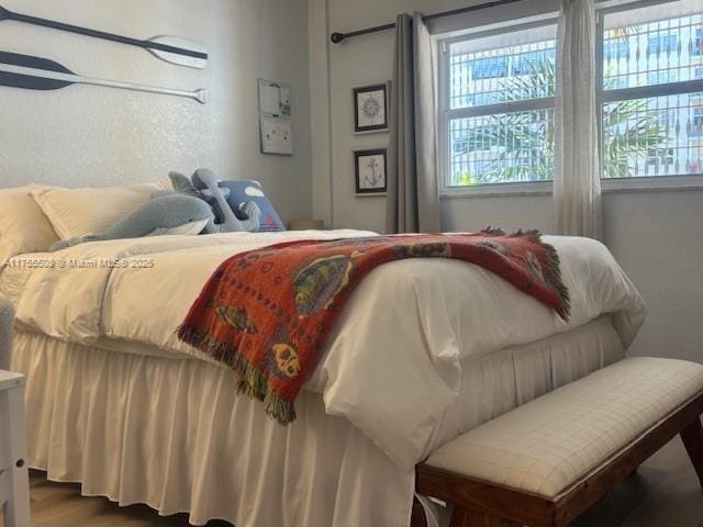 bedroom featuring wood finished floors