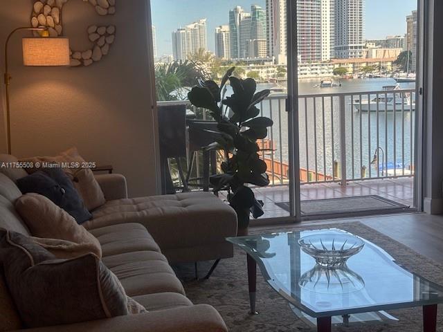 living room featuring a view of city and expansive windows