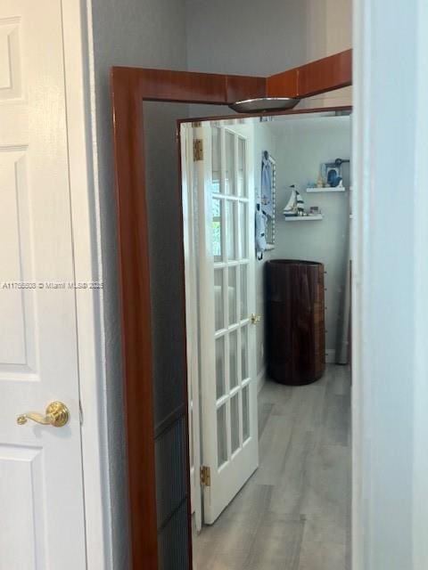hallway featuring light wood-style flooring