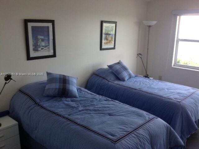 bedroom featuring multiple windows