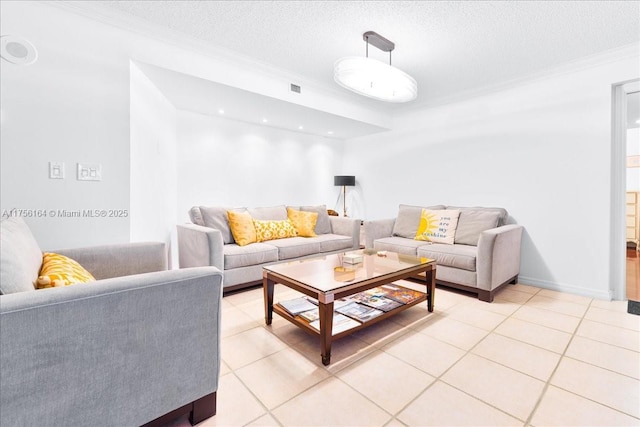 living area with visible vents, a textured ceiling, crown molding, light tile patterned floors, and baseboards