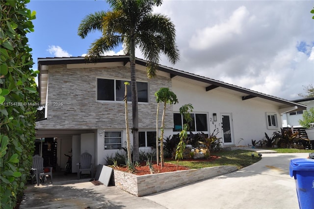 2413 Sugarloaf Ln, Fort Lauderdale, FL 33312 - tri-level home featuring stucco siding and stone siding