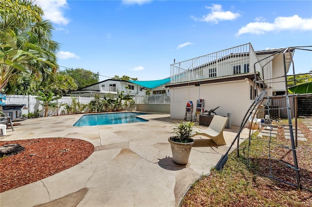 2413 Sugarloaf Ln, Fort Lauderdale, FL 33312 - view of swimming pool featuring a fenced backyard, a fenced in pool, and a patio area