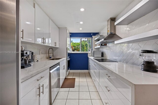 2413 Sugarloaf Ln, Fort Lauderdale, FL 33312 - kitchen with wall chimney range hood, open shelves, a sink, stainless steel appliances, and white cabinetry
