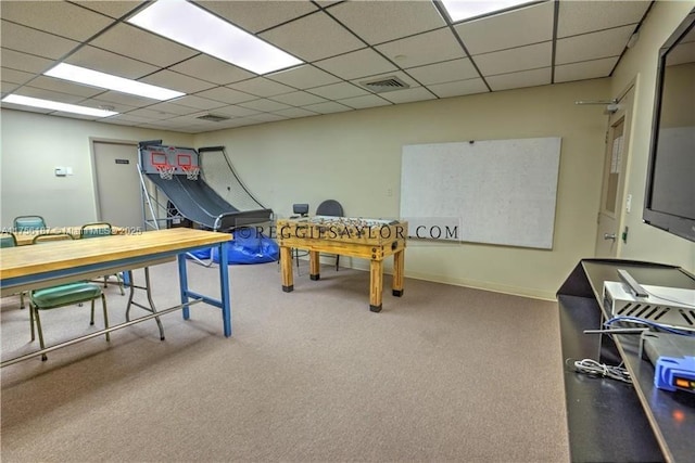 game room with a drop ceiling, visible vents, and baseboards