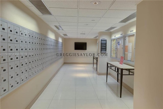 hallway featuring visible vents and mail area