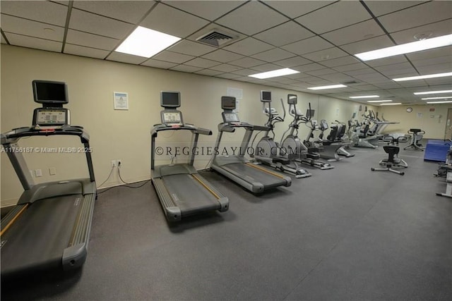 exercise room with visible vents and a drop ceiling