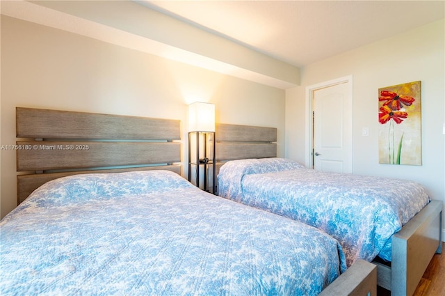 bedroom with wood finished floors