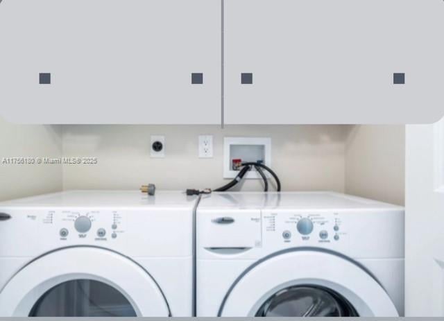 laundry room with laundry area and washing machine and clothes dryer