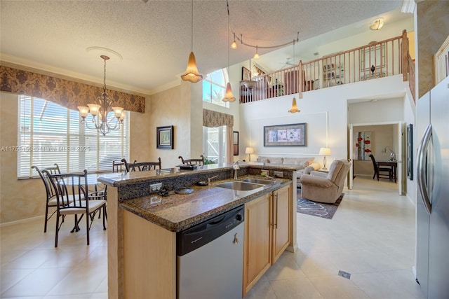 7800 NW 29th St, Margate, FL 33063 - kitchen featuring a chandelier, a textured ceiling, a sink, freestanding refrigerator, and dishwashing machine