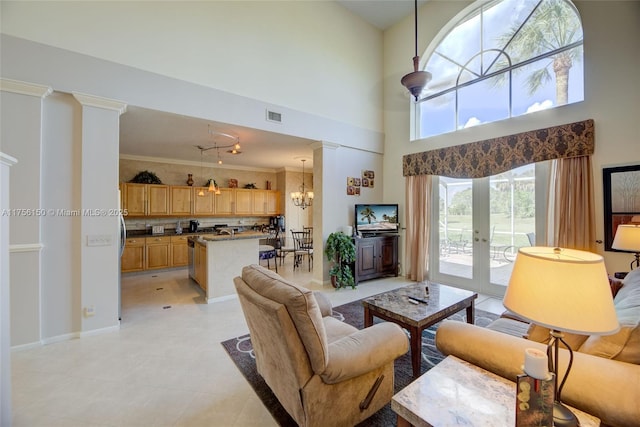 7800 NW 29th St, Margate, FL 33063 - living room featuring french doors, a chandelier, baseboards, visible vents, and ornamental molding