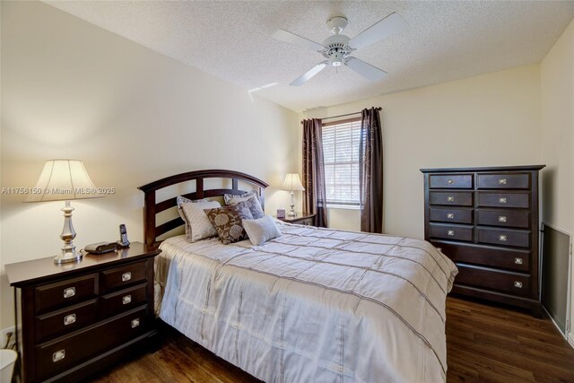 7800 NW 29th St, Margate, FL 33063 - bedroom with dark wood finished floors, ceiling fan, and a textured ceiling