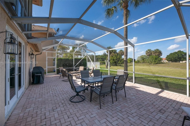 7800 NW 29th St, Margate, FL 33063 - view of patio / terrace featuring a grill, outdoor dining space, and a lanai