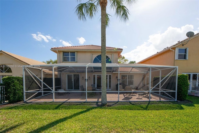 7800 NW 29th St, Margate, FL 33063 - back of house featuring glass enclosure, a tiled roof, stucco siding, and a patio