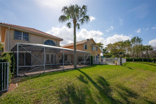 7800 NW 29th St, Margate, FL 33063 - rear view of house featuring stucco siding, a lanai, fence, and a lawn