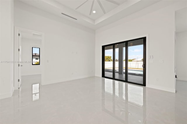 spare room featuring recessed lighting, french doors, marble finish floor, and baseboards