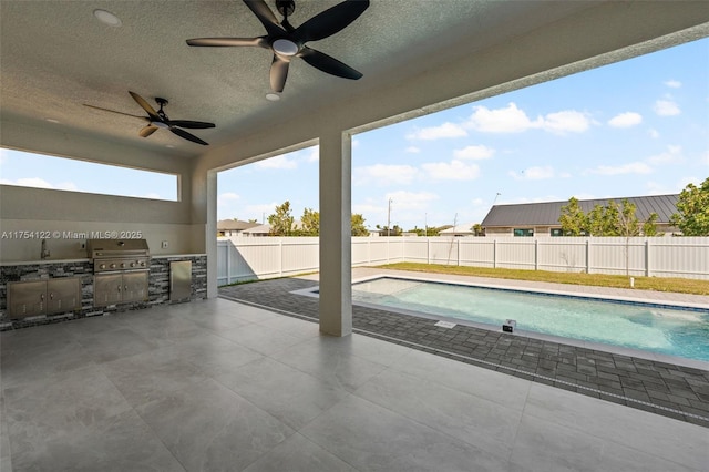 view of pool with a fenced backyard, a fenced in pool, a patio, and area for grilling