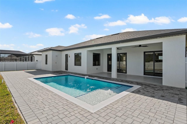 view of swimming pool with a fenced in pool, a patio area, ceiling fan, and fence