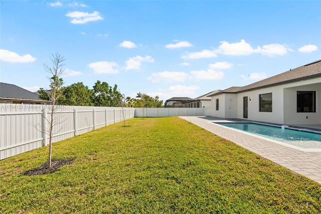 view of yard featuring a fenced in pool, a fenced backyard, and a patio