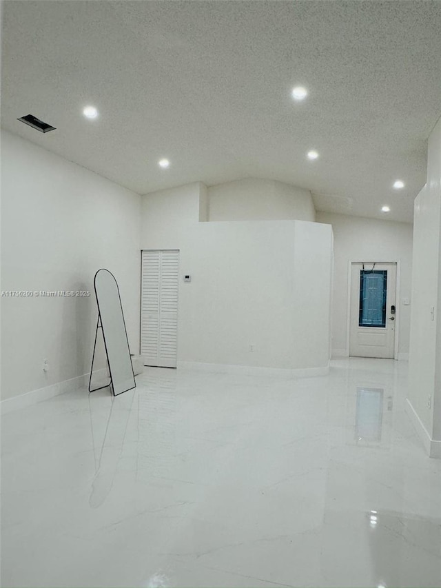 spare room featuring marble finish floor, visible vents, baseboards, and recessed lighting