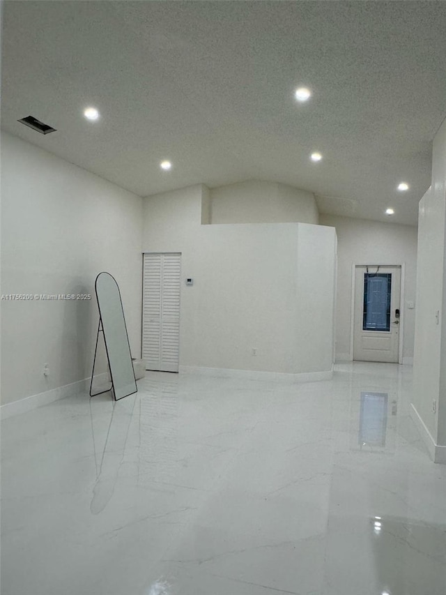 empty room with marble finish floor, baseboards, visible vents, and recessed lighting