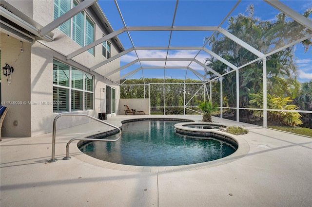 pool featuring a lanai, a patio, and an in ground hot tub