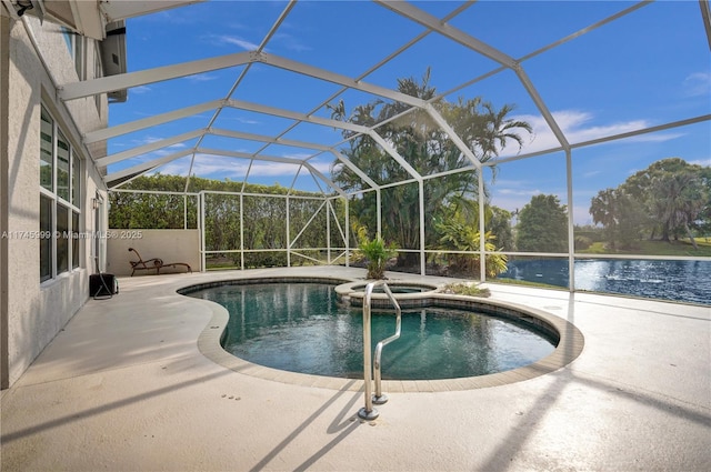 view of swimming pool with a pool with connected hot tub, a lanai, a patio area, and a water view