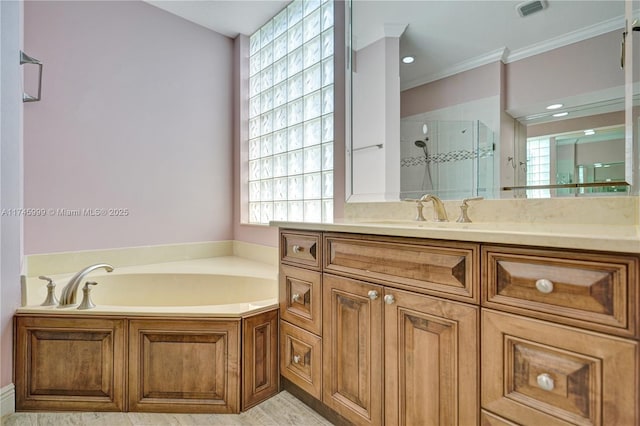 full bathroom with a garden tub, visible vents, ornamental molding, a shower stall, and vanity