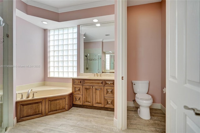 full bath featuring wood finished floors, vanity, ornamental molding, a bath, and a stall shower