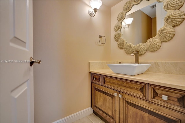 bathroom featuring tile patterned flooring, visible vents, vanity, and baseboards