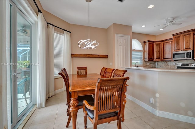 dining space featuring light tile patterned floors, ceiling fan, recessed lighting, visible vents, and baseboards