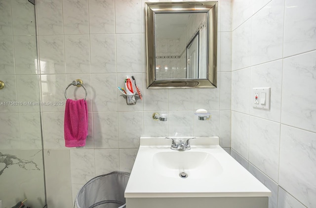 bathroom featuring tile walls and vanity