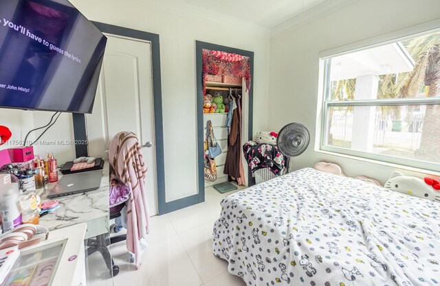 7385 SW 19th St Rd, Miami, FL 33155 - bedroom featuring light tile patterned floors, a closet, multiple windows, and crown molding