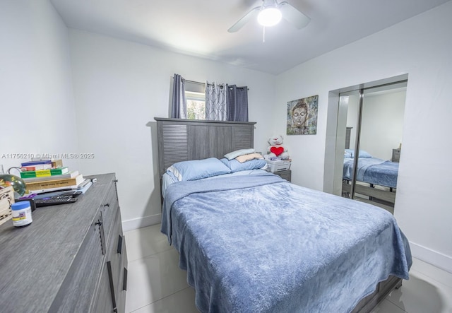 bedroom featuring a closet, baseboards, and a ceiling fan