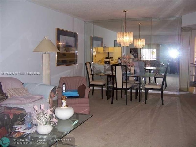 dining space with carpet floors and an inviting chandelier