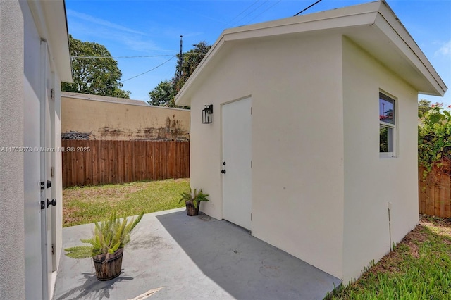 view of shed with fence
