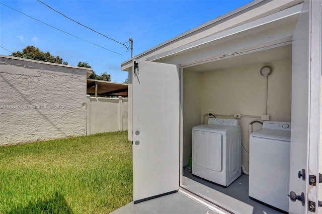 laundry area with washing machine and dryer
