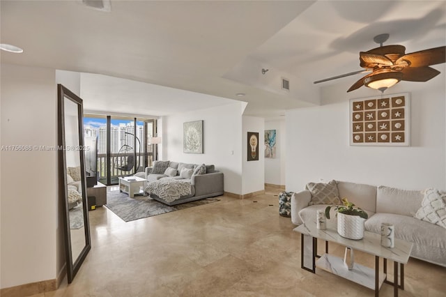 living room with baseboards, ceiling fan, visible vents, and floor to ceiling windows