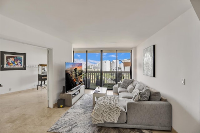 living room with expansive windows and baseboards