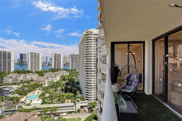 balcony with a water view and a city view