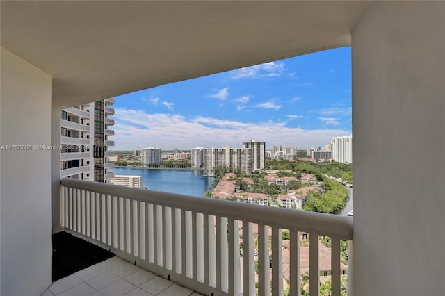 balcony with a view of city and a water view