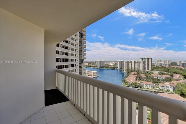 balcony with a water view and a city view