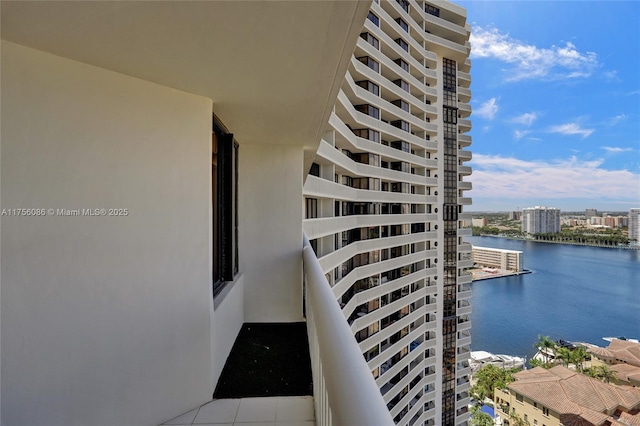 exterior space featuring a water view and a city view