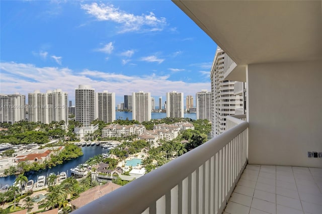 balcony with a water view and a city view