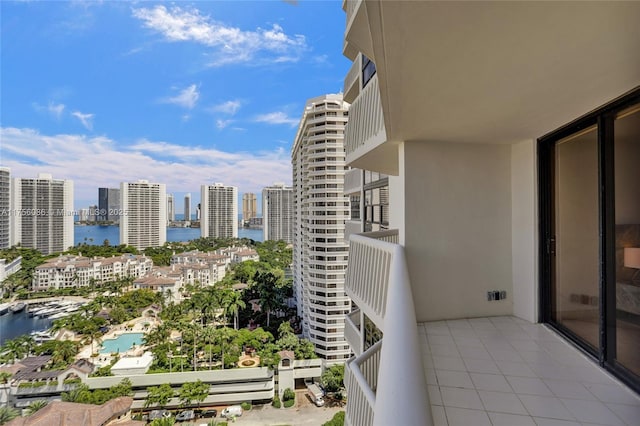 balcony with a view of city and a water view