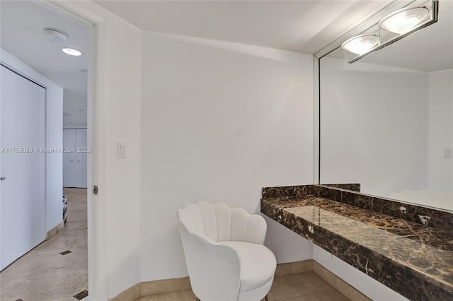 bathroom with tile patterned floors