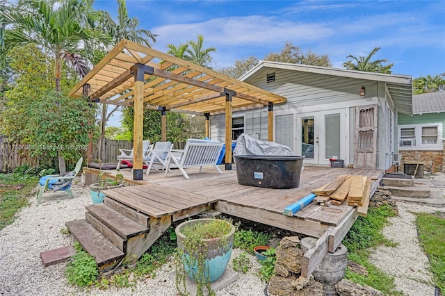 wooden terrace featuring fence and a pergola