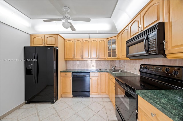 kitchen with black appliances, decorative backsplash, a sink, and light brown cabinetry